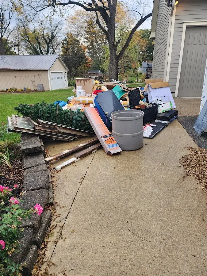 Dumpster being loaded with debris for Commercial Dumpster Rental in Pasadena Hills